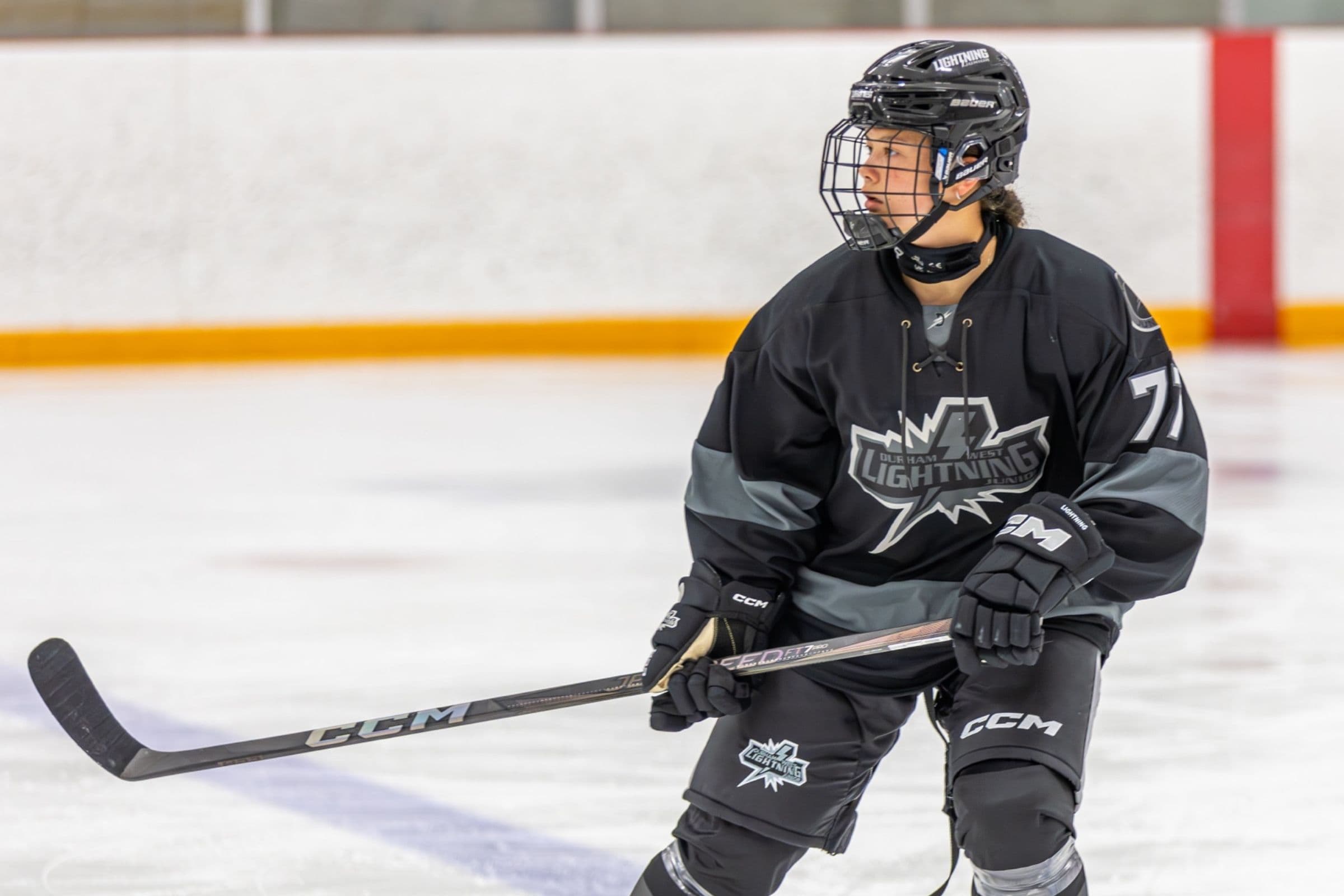 Lightning player number 77 glides in the black jersey with the team crest across the chest