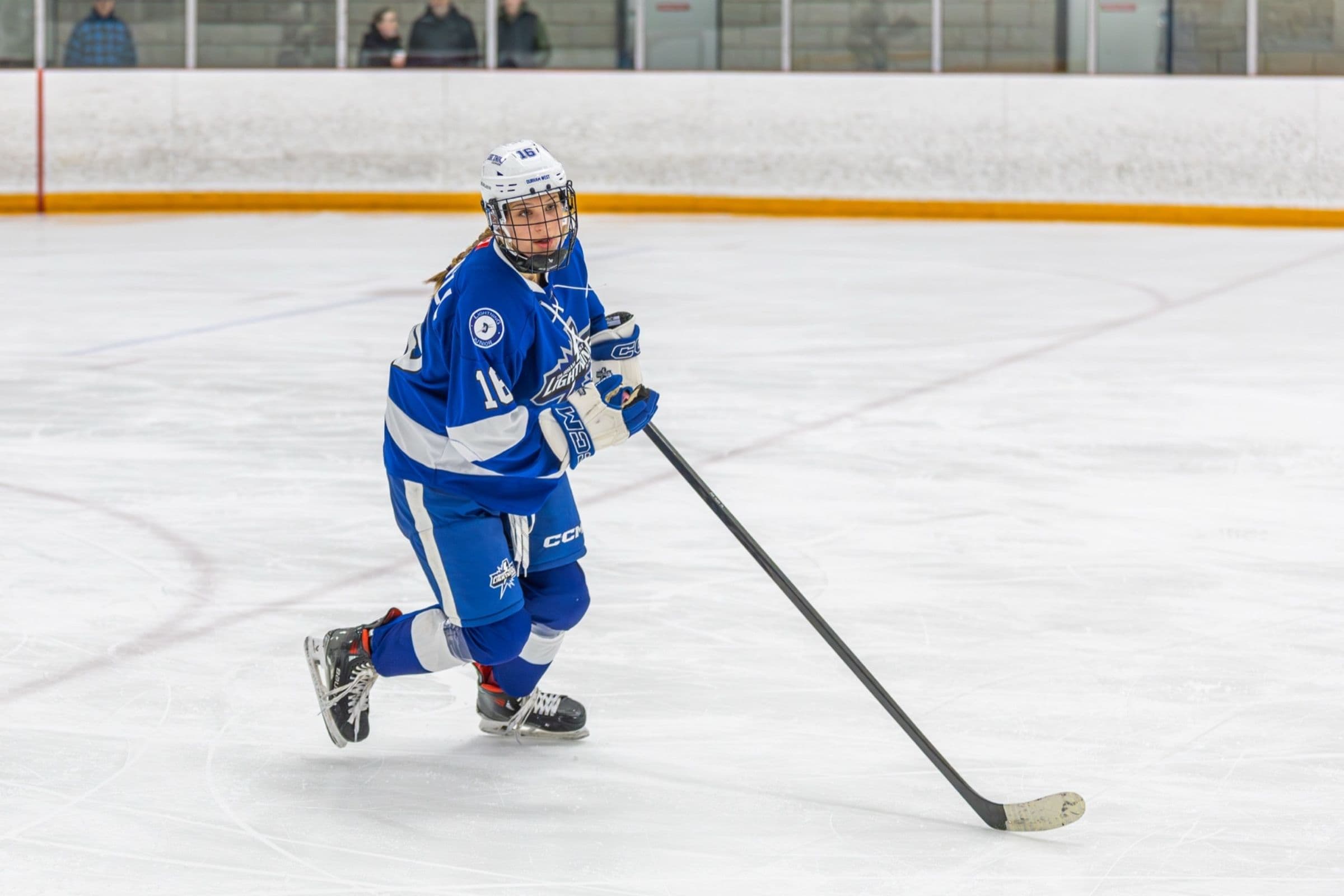 Lightning player number 16 carries the puck up the ice in the blue home jersey